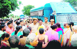 Agitated relatives of Asheema argue with police officials outside the district courts in Panchkula