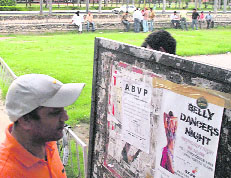 Poster of a club inviting students for belly dancers night pasted on the notice board at the students centre on the Panjab University campus in Chandigarh.