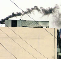 A diesel generator emanates smoke causing pollution in Ludhiana.