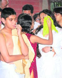 Malti, widow of IFS officer V.V Rao, who was killed in a blast in Kabul yesterday, is consoled by her daughter during his cremation in New Delhi