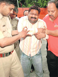 Samir Gupta cries in agony as he appears at the Sector 36 police station in Chandigarh on Wednesday.