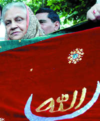 Chief Minister Sheila Dikshit with a chadar to be offered on her behalf at the Ajmer sharif Dargah, at her residence in New Delhi on Wednesday. 