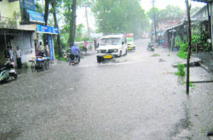 Flooding of the highway passing through Kangra town is a common sight. This is how it looked after rain on Tuesday evening. 