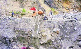 Labourers working along the Mughal Road which is under construction.