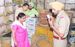 A team of the health department during a raid at a grocery shop in Ludhiana