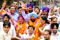 Newly elected mayor Baljeet Singh Birbehman with senior deputy mayor Tarsem Goyal and deputy mayor Gurinder Pal Kaur Mangat; Congress workers