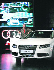 Audi India managing director Benoit Tiers poses with the Audi A4 motor-car at its launch in Mumbai on Thursday.