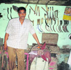 Jagbir Panchal displays his innovation, a fan that runs for five hours after winding it for five minutes.