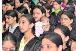 FACE OF FUTURE: A student of MTS College for Women holds her child during the annual convocation of the college in Ludhiana on Thursday.