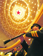 Chinese military band members play during the opening of the Beijing Olympics and Paralympics Games-time Work Mobilisation Rally at the Great Hall of the People in Beijing.