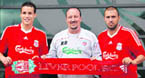 Liverpool Football Club manager Rafael Benitez (C) welcomes new signings, Swiss defender Philipp Degen (L) and Italian defender Andrea Dossena, at their Melwood training ground in Liverpool, northwest England on Thursday.