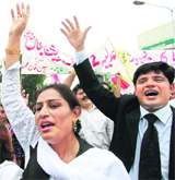 Lawyers chant slogans during a protest rally in Lahore