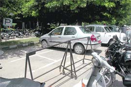 Barricades set up by the Milkfed authorities to park their official vehicles at a municipal corporation parking lot in Sector 34, Chandigarh. 