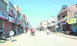 A market in Sirsa wears a deserted look following a call for a bandh by the INLD