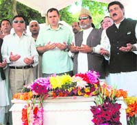 National Conference party president Omar Abdullah and supporters of the party offer prayers at the grave of Begum Akbar Jahan, wife of late Sheikh Mohammed Abdullah, at the eighth death anniversary at Hazratbal on the outskirts of Srinagar on Friday