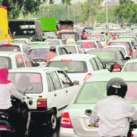 Vehicles stranded for hours on the Chandigarh-Panchkula road near the housing board chowk due to waterlogging on Saturday.