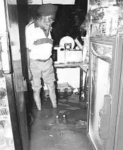 A shopkeeper in Dera Bassi surveys the condition of his shop on Saturday.