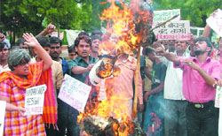 Delhi CPI (M) activists burn the effigy of Prime Minister Dr Manmohan Singh during a protest against the Indo-US nuclear deal in New Delhi