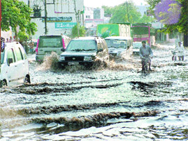 With monsoon showers lashing the city, commuters have a harrowing time.