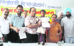 Fatehgarh Sahib deputy commissioner Ashok Kumar Singla gives a certificate to a physically challenged child in Amloh on Friday.
