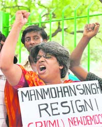 CPM-L activists shout anti-government slogans during a protest against the nuclear deal in New Delhi