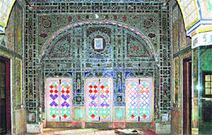 Panels of glass mosaic have been designed in vegetal and geometrical patterns.