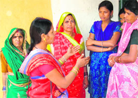 A Kalyani Club member educates village women in Chhattisgarh on health issues.