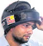 Gurvinder Singh with his helmet-cum-mobile.