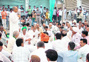 Farmers hold a mahapanchayat at the Ramlila ground in Gurgaon on Sunday against the proposed SEZ in the city.