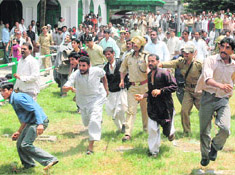 NC workers charge towards people who threw stones at the rally.