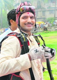 Skydiver Shishir Mishra proceeds to the wedding dais after landing from 6,000 ft in Bhubaneswar