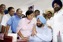 ALL SMILes: Baljeet Singh Birbehman, the first mayor of the Bathinda municipal Corporation (BMC), is congratulated by his deputies and councillors at the BMC office on Monday.