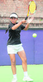 Nehal Sahni returns a shot in under-18 category during the AITA tennis tourney at CLTA, Sector 10, on Monday. 