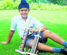 Karandeep Kochhar with the winner and runner-up trophies he won in two 9-10 age-group tournaments held in North Carolina last week.