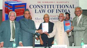 Vice-President Md Hamid Ansari with Karan Singh, Soli Sorabji and former Chief Justice of the Supreme Court of India J.S. Verma releases Subhash C. Kashyaps (centre) book Constitutional Law of India in New Delhi on Monday. 