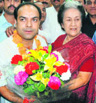 CLP leader Vidya Stokes congratulates Manmohan Katoch, newly elected president of the state Youth Congress, during a function at the Congress office in Shimla on Monday.