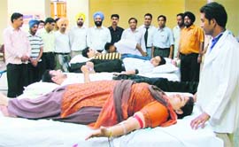 Lawyers donate blood in a camp organised at the District Bar Association in Ludhiana on Monday.