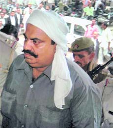 Expelled Samajwadi Party MP Atiq Ahmed being produced at the district courts in connection with the Raju Pal murder case in Allahabad