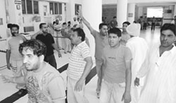 Family members protest the death of Arshid Khan who allegedly died due to negligence of a doctor at Gian Sagar Hospital in Banur