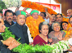 Former Speaker Kaul Singh Thakur (garlanded) along with senior leaders Virbhadra Singh, CLP leader Vidya Stokes and Viplove Thakur after he assumed charge as the president of the state Congress in Shimla on Tuesday.