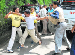 A scuffle over haphazard parking outside Congress Bhawan in Shimla on Tuesday.