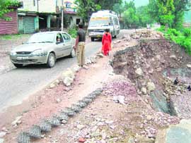 This patch of the National Highway No 21 at Jarol, near Sundernagar, has not been repaired for the past one year. It seems the government is waiting for a tragedy to spur it into action.