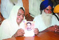 Parents of deceased Onkar Singh address a press conference in Jalandhar on Tuesday.