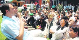 National Conference leader Omar Abdullah addressing party workers at his residence in Srinagar on Tuesday.