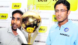 Sri Lankan captain Mahela Jayawardene (L) and his Indian counterpart Anil Kumble pose with a trophy at a press conference in Colombo on Tuesday at the launch of Indias tour of Sri Lanka. The teams will play three Test matches and five ODIs starting July 23.