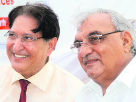 Haryana Chief Minister Bhupinder Singh Hooda with Panjab Universitys Vice-Chancellor R.C. Sobti during the foundation-laying ceremony of the University Institute of Applied Management Sciences on the university campus on Wednesday.