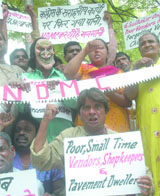 Vendors and pavement dwellers under the banner of the National Human Rights Council protest against the NDMC at Jantar Mantar in New Delhi 