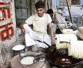 A halwai prepares the seasonal sweet ghewar in Bada Bazar in Rohtak.