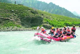 Foreign rafters participating in the first Kashmir Cup International Rafting Championship at Sonamarg, about 100 km from Srinagar, on Wednesday. 