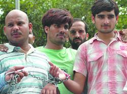 Three persons arrested by a team of the Special Operation Squad ( SOS), Crime Branch, Delhi Police, for firing and robbery in a jewellery shop in New Delhi on Thurday. 